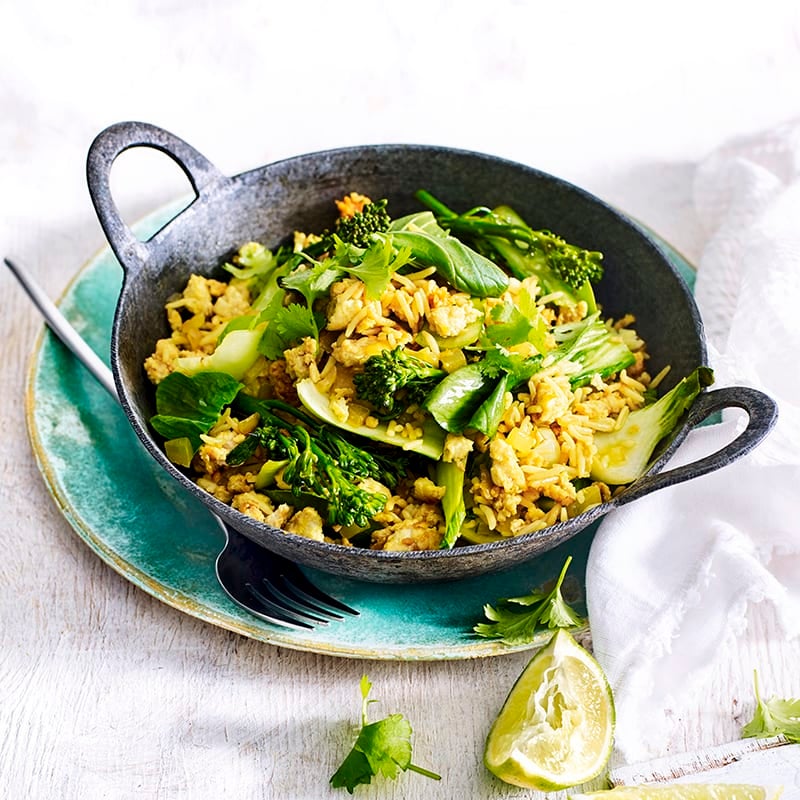 Photo of Turmeric spiced rice bowl with stir-fried chicken and greens by WW