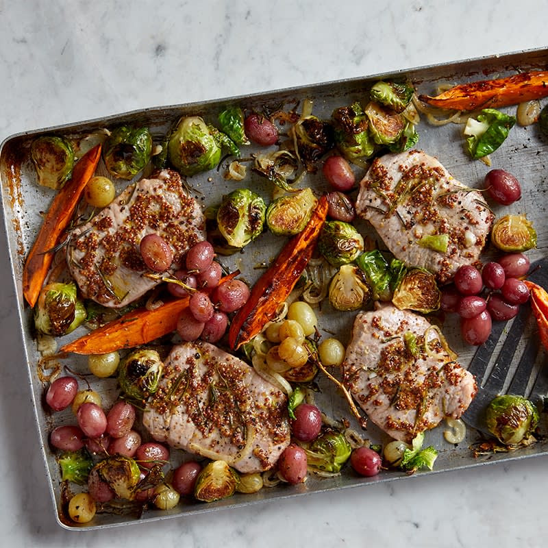 Rosemary pork with sweet potato, sprouts and grapes tray bake