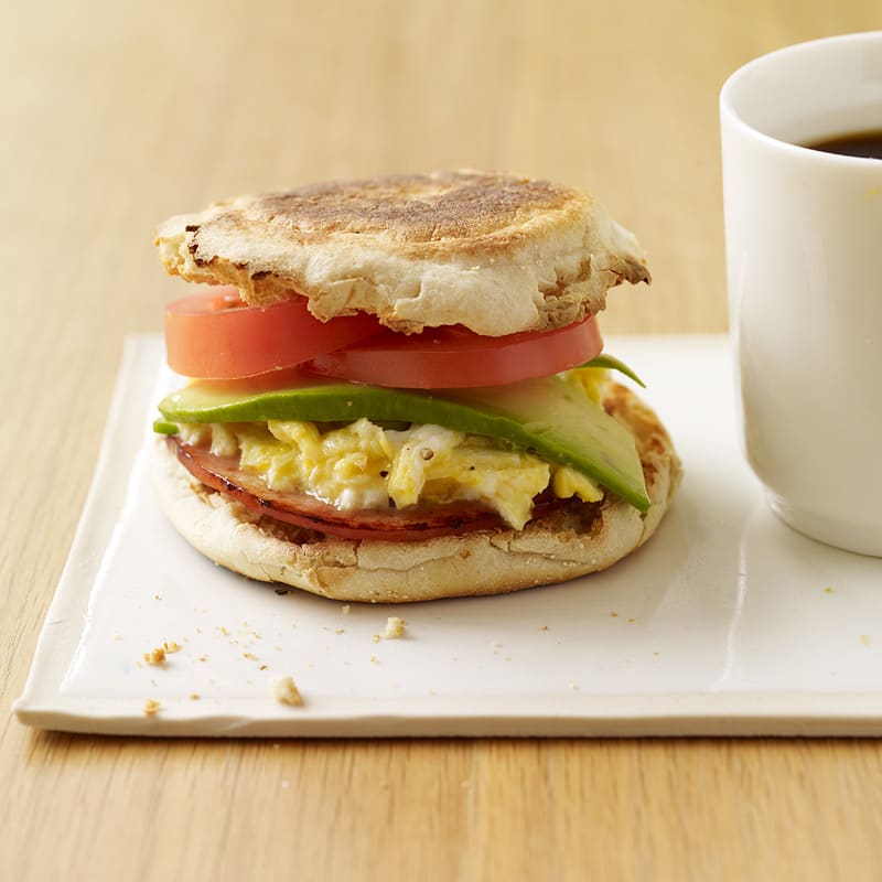 Egg and bacon sandwich with avocado and tomato