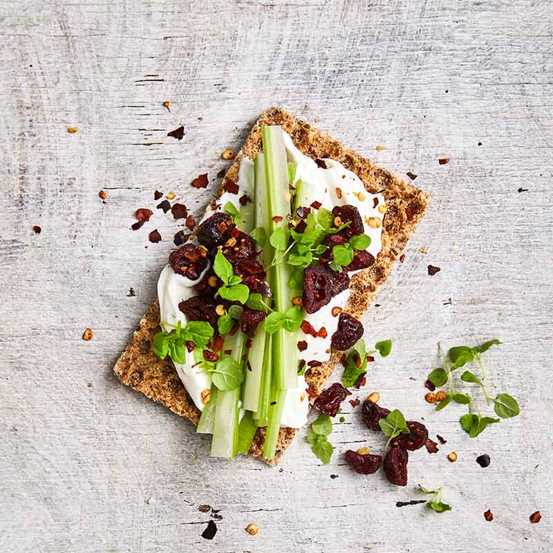 Crispbread topped with tzatziki and celery