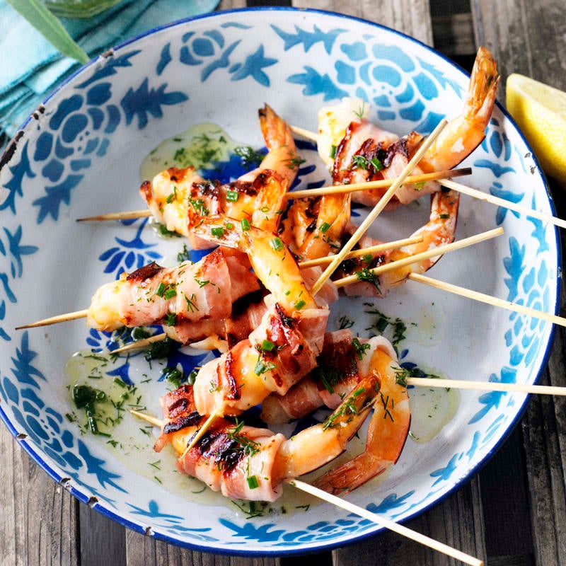 Prawn and bacon skewers with herb dressing