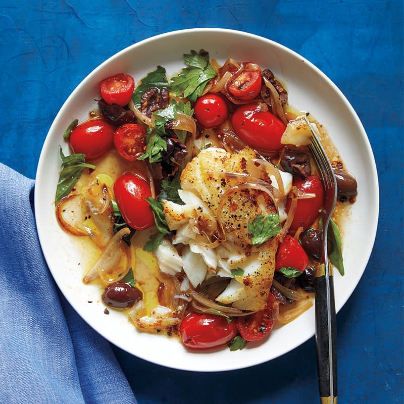 Sautéed fish with tomato and olives